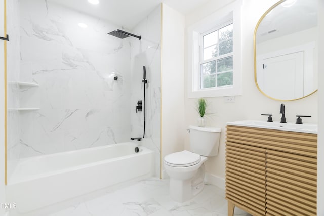 full bathroom with tiled shower / bath, vanity, and toilet