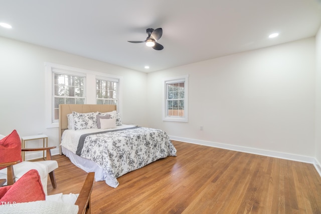 bedroom featuring hardwood / wood-style floors and ceiling fan