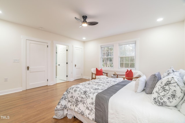 bedroom with ceiling fan and light wood-type flooring