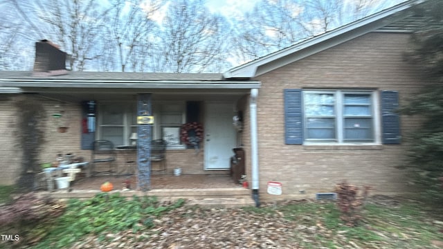 entrance to property with a porch