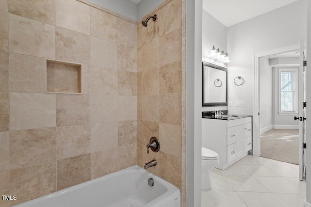 bathroom featuring tile patterned flooring, toilet, shower / tub combination, vanity, and baseboards