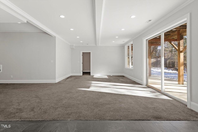 unfurnished room with carpet floors, crown molding, and baseboards