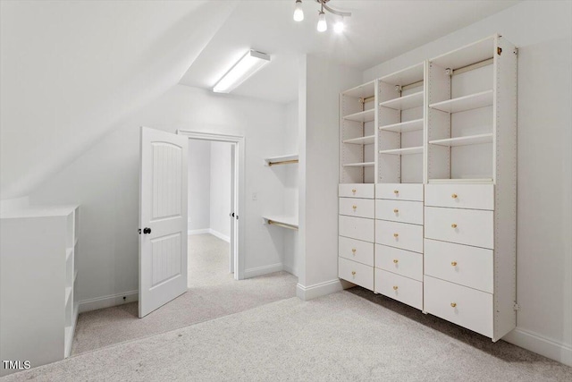 interior space featuring light carpet and baseboards