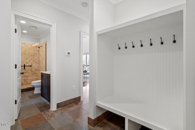 mudroom featuring crown molding, stone tile floors, recessed lighting, visible vents, and baseboards