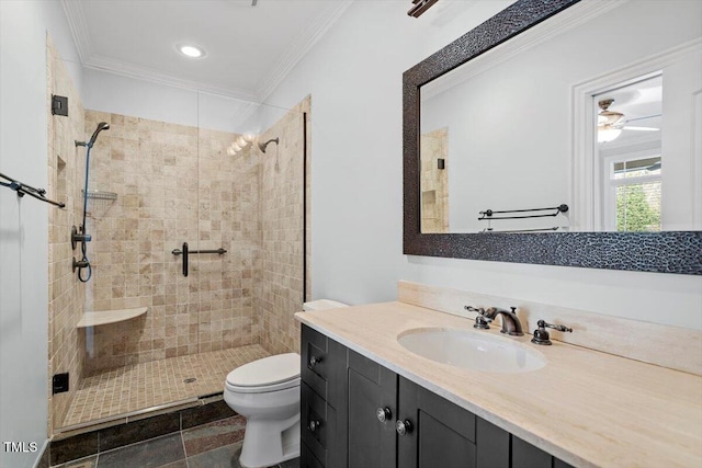 bathroom with toilet, ornamental molding, a shower stall, and vanity