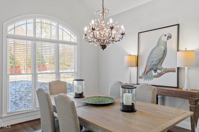 dining room with an inviting chandelier and wood finished floors