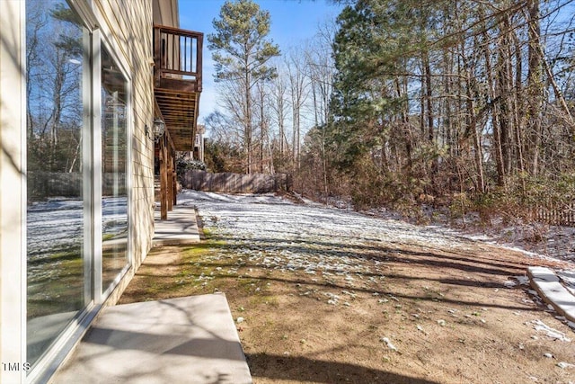 snowy yard featuring stairway