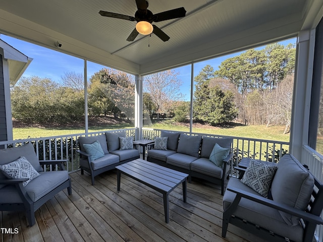 sunroom with a healthy amount of sunlight and a ceiling fan