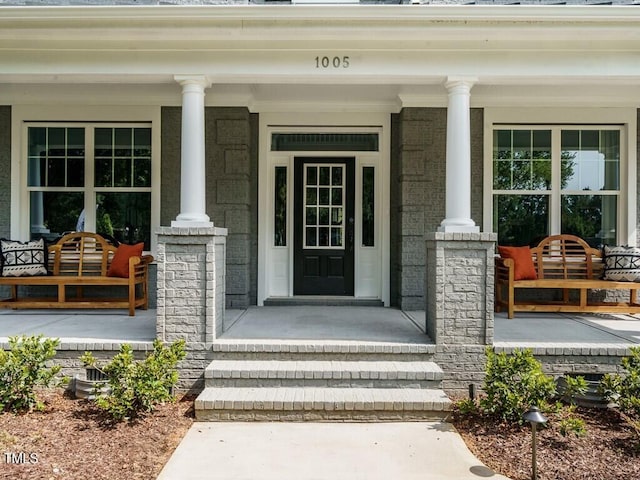 doorway to property with covered porch