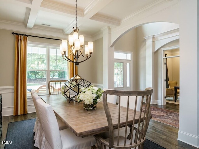 dining room featuring dark wood-style floors, beamed ceiling, plenty of natural light, and visible vents