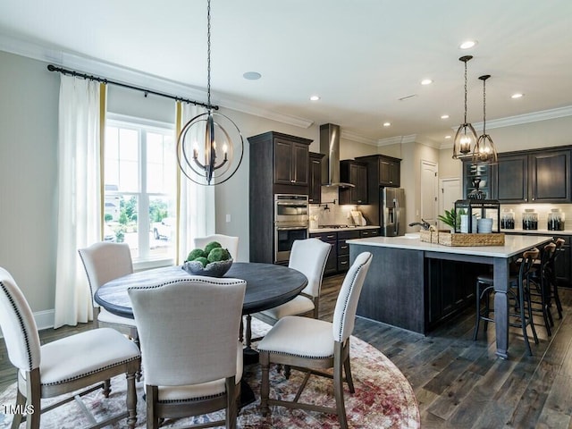 dining room featuring ornamental molding, recessed lighting, dark wood finished floors, and baseboards