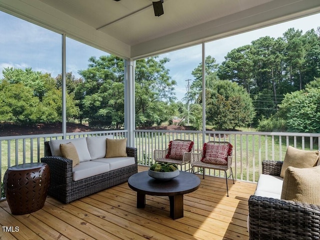 sunroom / solarium with a wealth of natural light and a ceiling fan