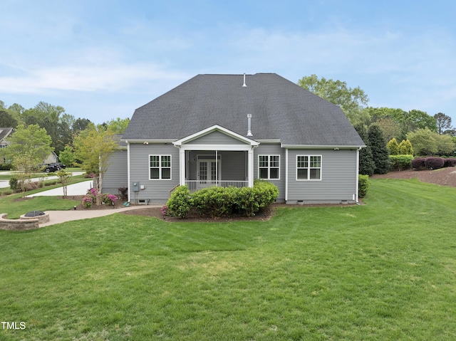 back of property featuring a shingled roof, a yard, a patio area, crawl space, and a fire pit