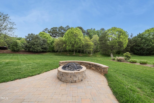 view of patio / terrace featuring an outdoor fire pit