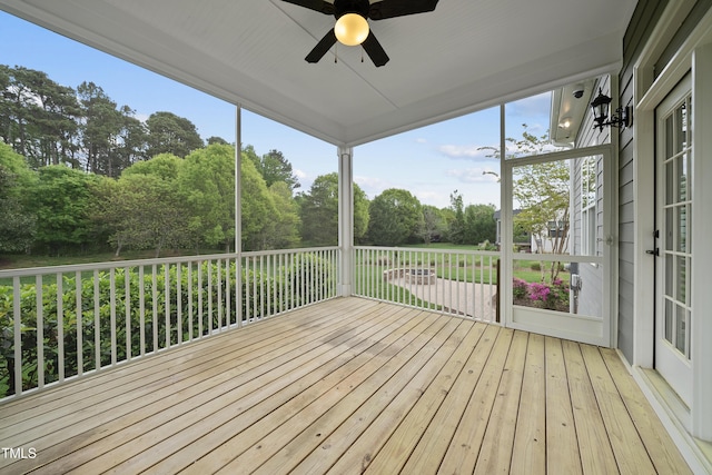wooden deck featuring a ceiling fan