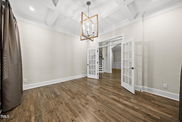 unfurnished dining area featuring beamed ceiling, french doors, an inviting chandelier, and coffered ceiling