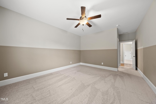 additional living space featuring light carpet, baseboards, and ceiling fan