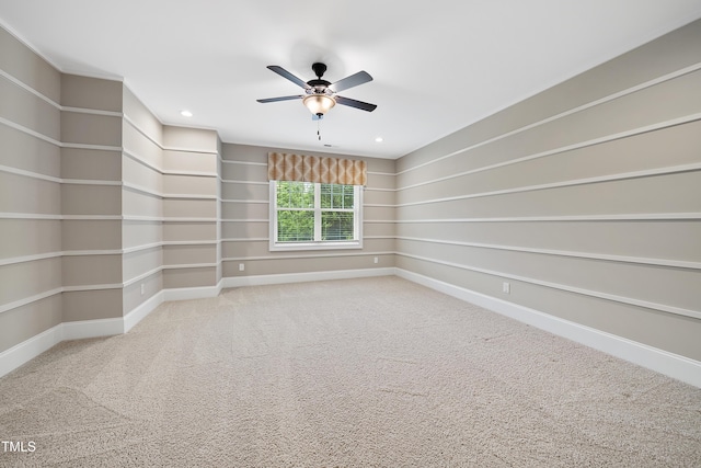 carpeted empty room with baseboards, a ceiling fan, and recessed lighting