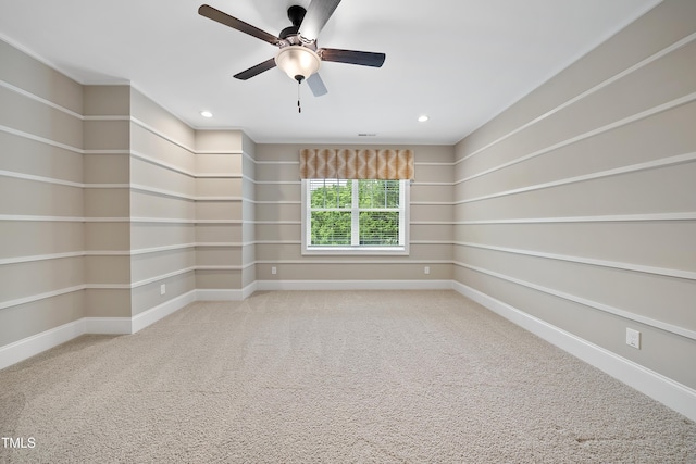 carpeted spare room featuring baseboards, a ceiling fan, and recessed lighting