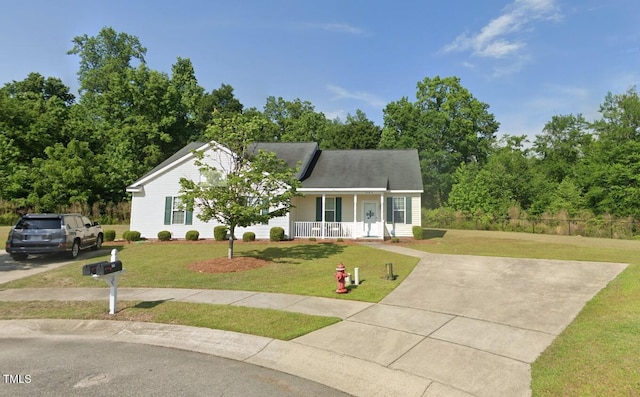 view of front of property with a front yard and covered porch