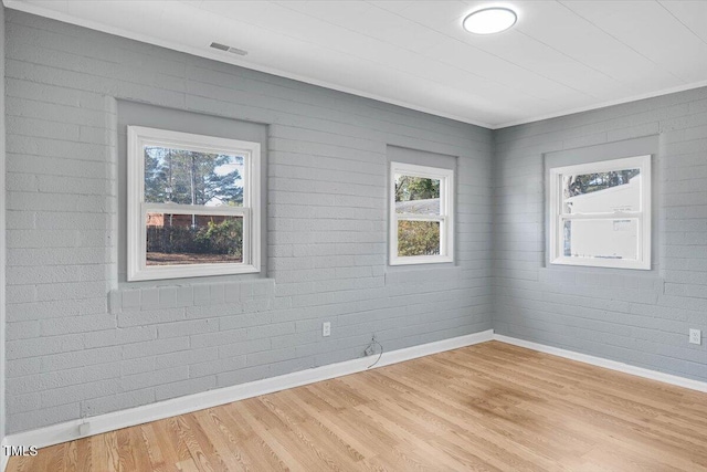 unfurnished room with light wood-type flooring