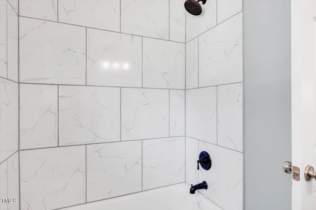 details with tiled shower / bath combo