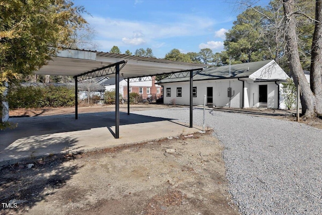 exterior space with a carport