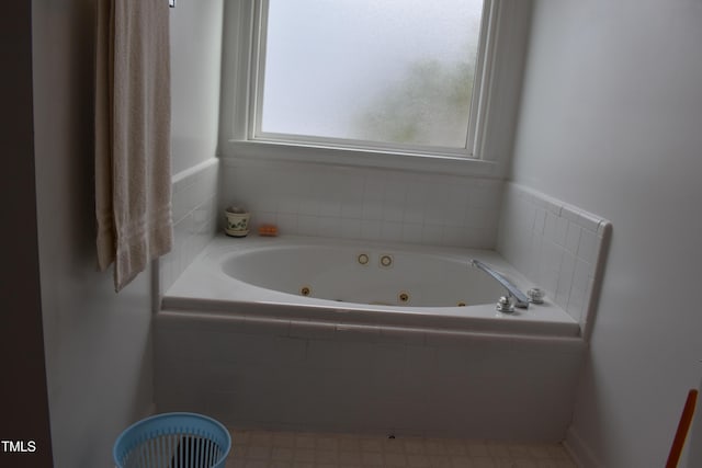 bathroom with tiled bath