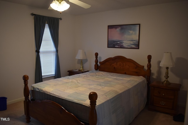 carpeted bedroom featuring multiple windows and ceiling fan