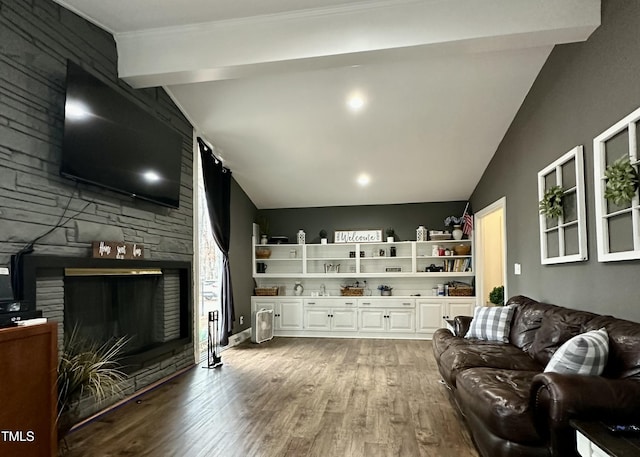 living room featuring hardwood / wood-style flooring and a fireplace