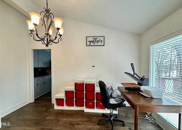 office area featuring vaulted ceiling, a chandelier, and dark hardwood / wood-style flooring