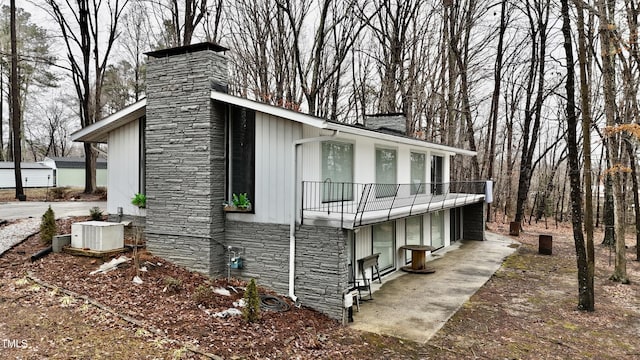 view of side of property featuring central AC unit