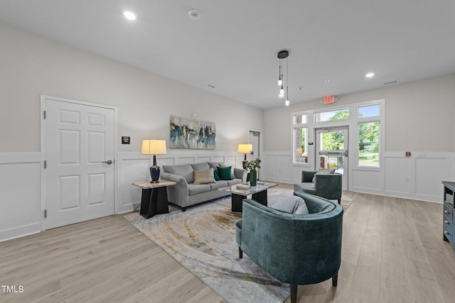 1400 Gathering Park Cir Unit 202, Cary, NC 27519 - living area with light wood finished floors, a wainscoted wall, recessed lighting, and a decorative wall