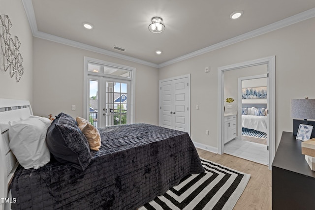 1400 Gathering Park Cir Unit 202, Cary, NC 27519 - bedroom with light wood-style floors, crown molding, french doors, recessed lighting, and ensuite bathroom