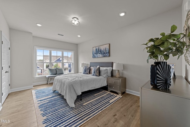 1400 Gathering Park Cir Unit 202, Cary, NC 27519 - bedroom with light wood finished floors and recessed lighting