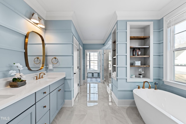 full bathroom featuring double vanity, a freestanding bath, ornamental molding, a stall shower, and a sink