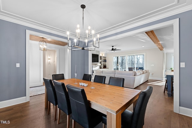 dining area featuring baseboards, ornamental molding, and dark wood finished floors