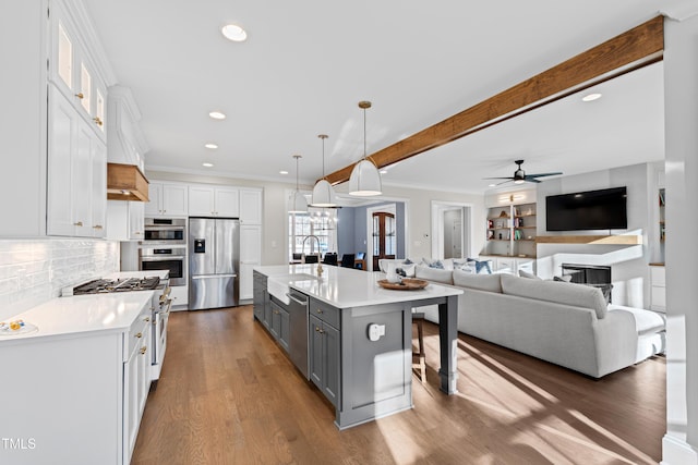 kitchen featuring stainless steel appliances, light countertops, white cabinetry, and gray cabinetry