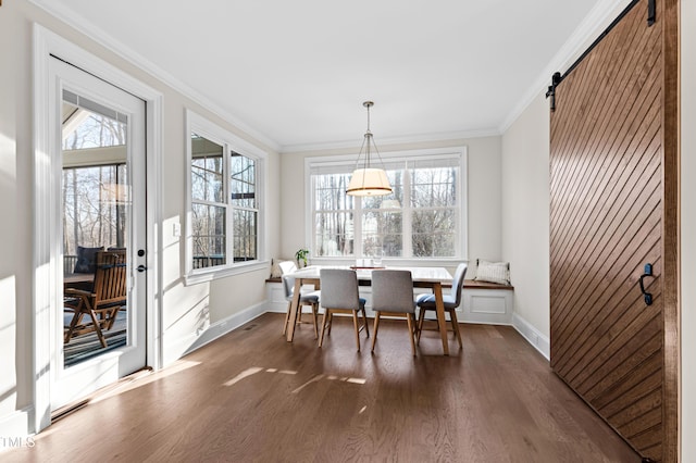 dining space featuring plenty of natural light, ornamental molding, and dark wood-type flooring