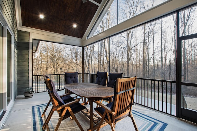 sunroom / solarium with lofted ceiling and wooden ceiling