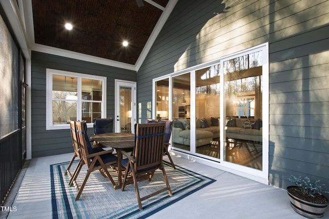 sunroom featuring lofted ceiling