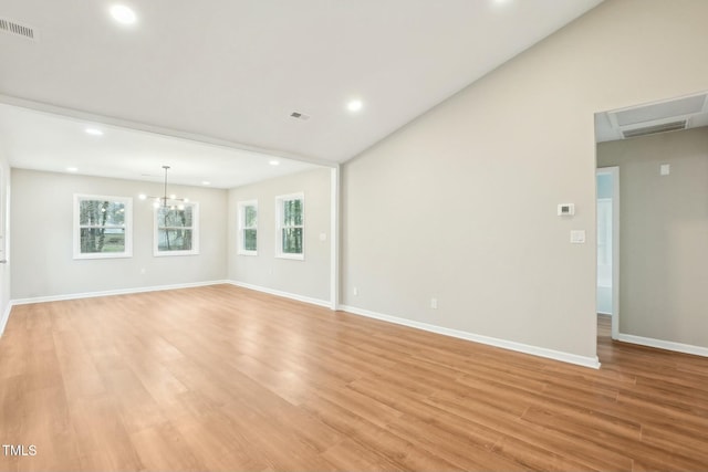 unfurnished room featuring light wood-type flooring, visible vents, baseboards, and a wealth of natural light