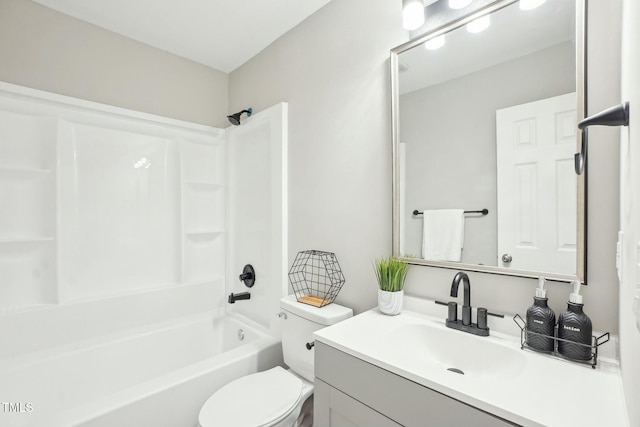 bathroom with shower / bathing tub combination, toilet, and vanity