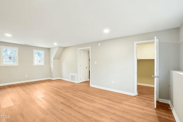 interior space featuring light wood finished floors, visible vents, recessed lighting, and baseboards