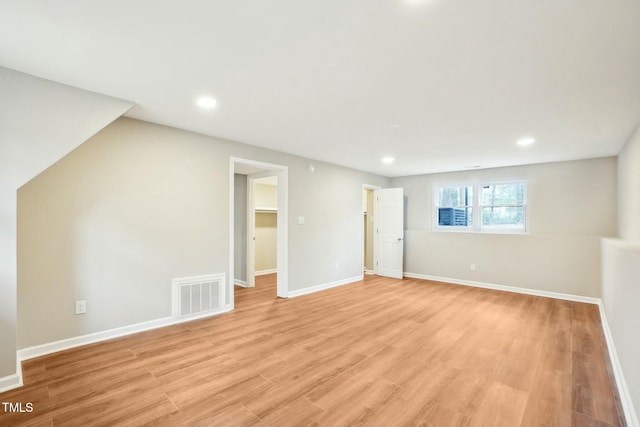 interior space featuring recessed lighting, visible vents, light wood-style flooring, and baseboards