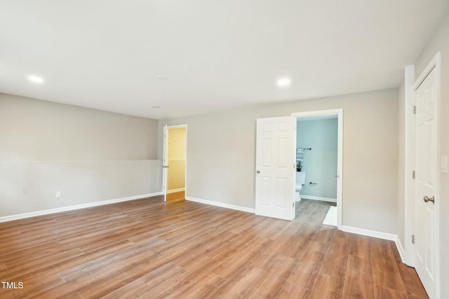 interior space with recessed lighting, light wood-type flooring, and baseboards