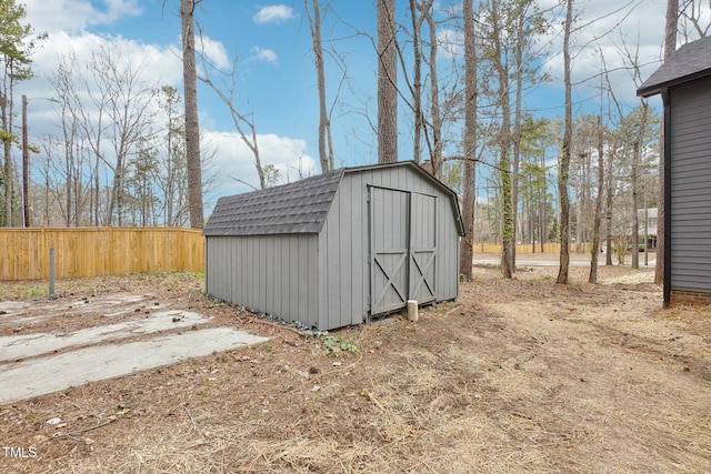 view of shed with fence