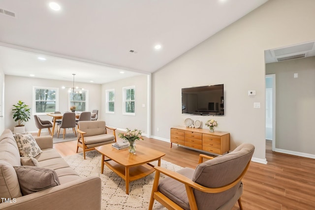 living room with light wood finished floors, visible vents, recessed lighting, and baseboards