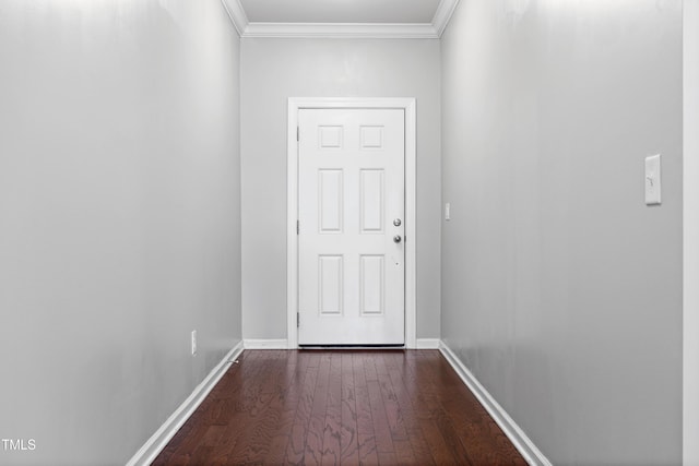 doorway to outside featuring dark wood-style flooring, crown molding, and baseboards