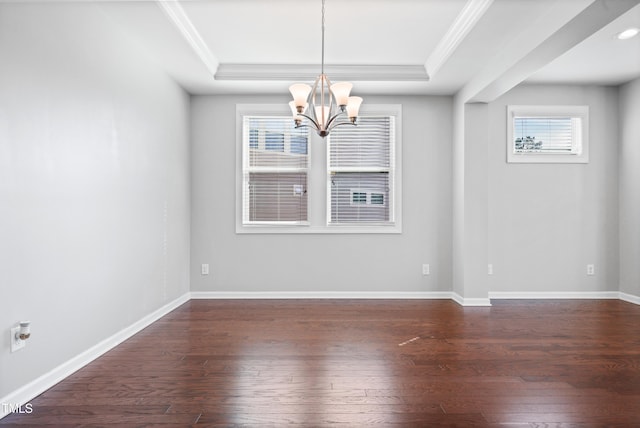 unfurnished dining area with dark wood-style floors, a tray ceiling, a chandelier, and ornamental molding